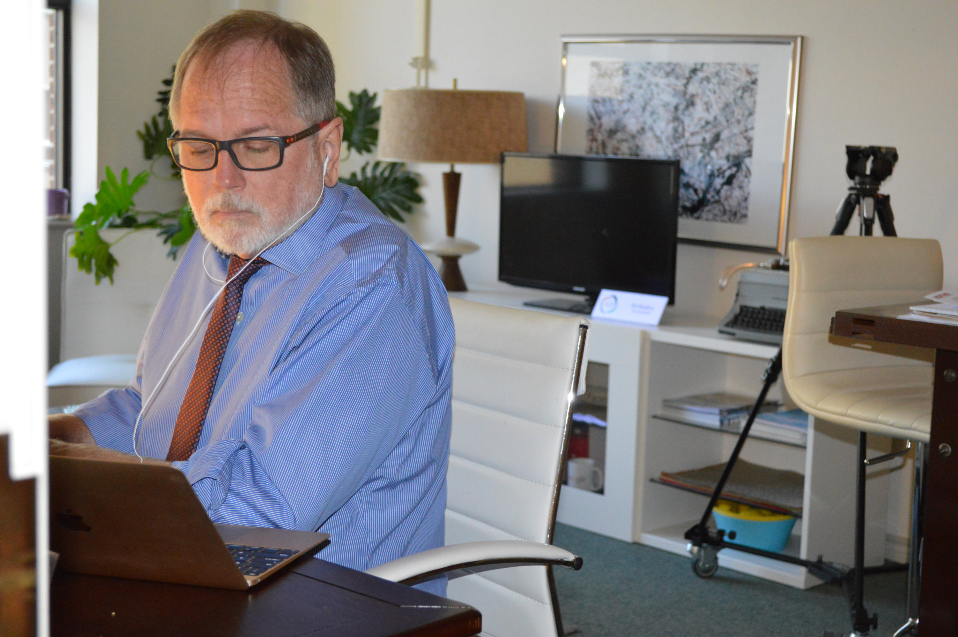 Jesse Mullins, editing in his office.